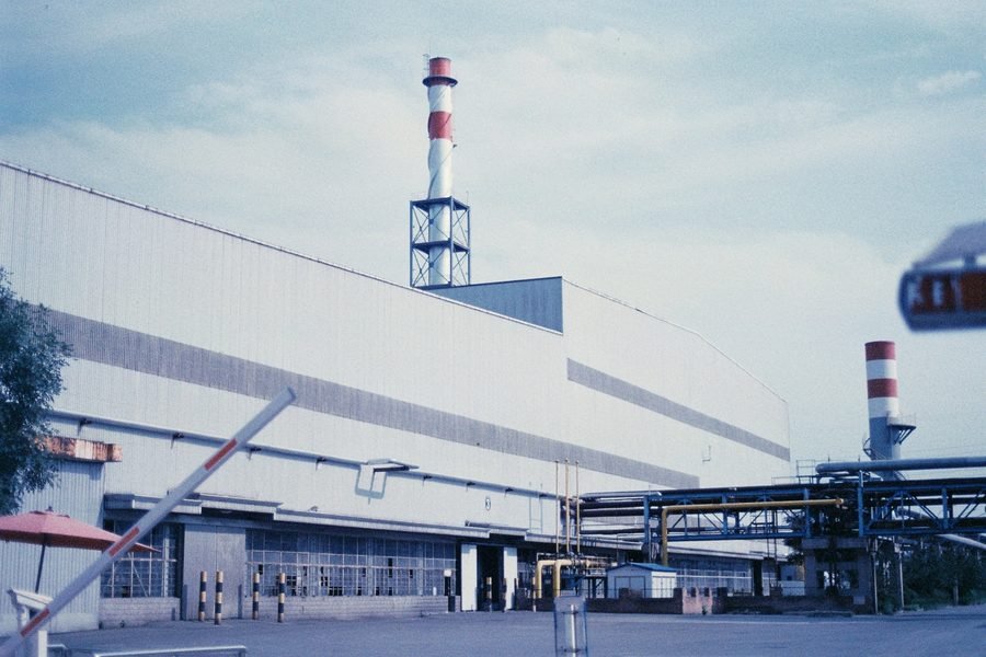Factory gate with boom barrier
