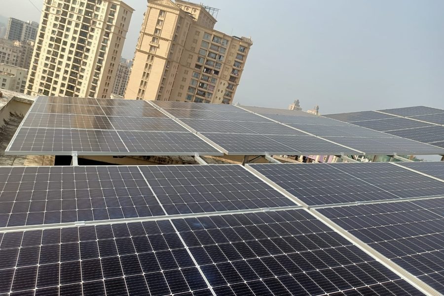 Solar panels on a terrace with a building view